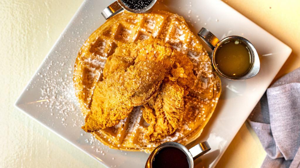 Buttermilk Fried Chicken & Waffles · Battered chicken breast fried to a golden crisp, alongside our fluffy Belgian waffle. Served with honey hot sauce on side.