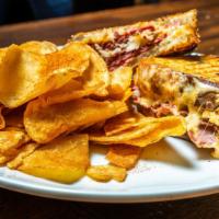 Classic Reuben · House cooked corned beef, sauerkraut, Swiss cheese, thousand island dressing, grilled marble...