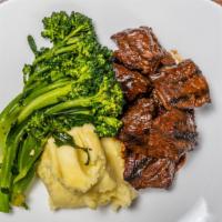 Hugh'S Famous Marinated Steak Tips · Sirloin tips, broccolini, and red wine sauce; served with your choice of mashed potatoes, ha...