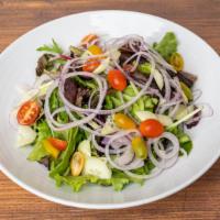Casa Salad · Mixed organic greens, onions, tomatoes, cucumbers, vinaigrette.