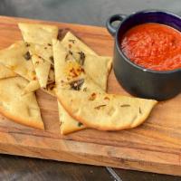 Kim'S Gypsy Flatbread · oil, salt, spicy red pepper flakes, rosemary, side of red sauce.