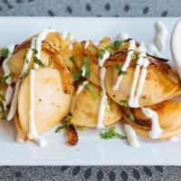 Mini Potato Pierogies · sautéed onions, sour cream.