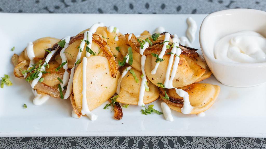 Mini Potato Pierogies · sautéed onions, sour cream.