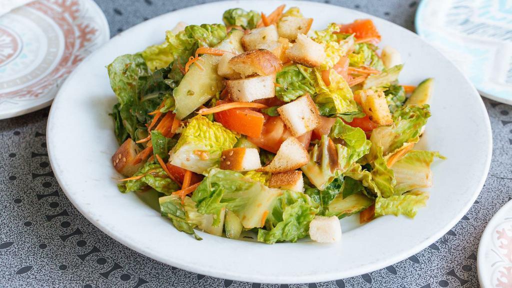 House Salad · romaine & iceberg lettuce, tomatoes, cucumbers, carrots, chickpeas, croutons, red wine vinaigrette.