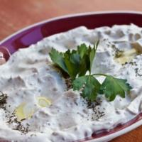 Labni · Homemade creamy thick strained yogurt, sprinkled with crushed mint and olive oil. Served wit...