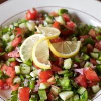 Shepherd Salad · Fresh tomatoes, cucumber, onions, parsley, and dressing.