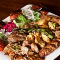 Mixed Grill · One skewer each of adana kebab, lamb shish kebab, and kofte kebab. Served with bulqur, salad...