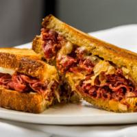 Grill Reuben · Grilled Corned beef, melted Swiss cheese, coleslaw or sourkraut, Russian dressing on the rye...