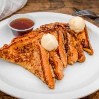 Texas French Toast · Two slices of our delicious french toast made from thick white bread buttered on both sides ...