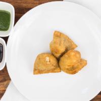 Vegetable Samosa · Most popular. Vegan. Two Pieces. Deep fried crispy turnovers stuffed with mildly spiced pota...