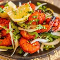 Tandoori Shrimp · Marinated shrimp gently seasoned with Indian spices and grilled in a tandoor clay oven.