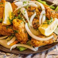 Chicken Seekh Kebab · Mix of minced chicken, onions, ginger, and Indian spices, rolled and baked in a tandoor clay...