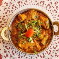 Karahi Chicken · Boneless chicken cubes cooked with bell peppers, onions, tomatoes, and ginger, with Indian h...
