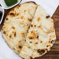 Butter Naan · Most popular. Soft, fluffy buttered bread, baked in clay oven.