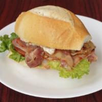 Misto Completo · Ham, bacon, egg, cheese, lettuce, tomato on a french roll.