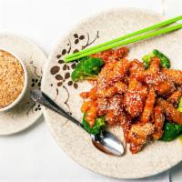 Sesame Chicken · Served with an egg roll or crab puff, steamed or fried rice, and soup. *Lunch served daily f...