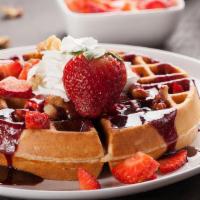 Fried Belgium Waffles · Crispy Deep Fried Belgium Waffle Topped with berry compote, whipped cream, and powdered suga...