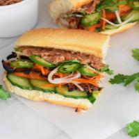 Grilled Chicken Banh Mi · Lemongrass marinated chicken thigh, topped with fresh cilantro, sweet chili sauce, cucumber,...