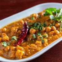 Chana Masala · Chick-peas (garbanzo beans) cooked in a special blend of traditional spices.