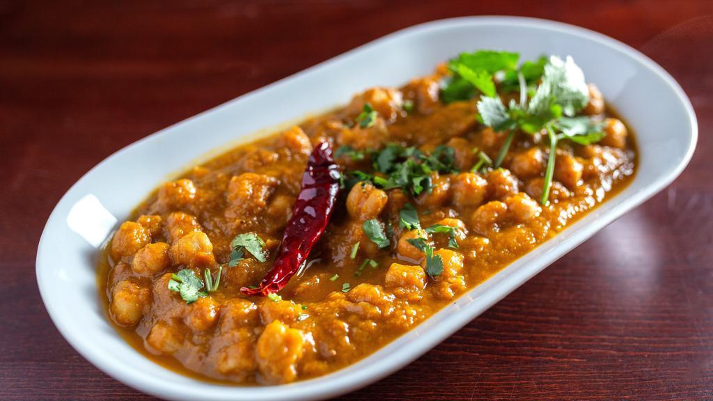Chana Masala · Chick-peas (garbanzo beans) cooked in a special blend of traditional spices.
