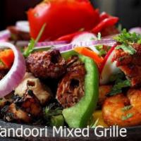 Special Tandoori Mix Grill · Combination platter of tandoori - chicken tikka, chicken seekh kebab, lamb seekh kebab, shri...