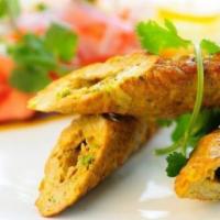 Seekh Kebab (Chicken) · Ground minced chicken mixed with onion, ginger, and herbs.