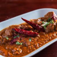 Vindaloo · Beef or goat cooked with potatoes in a spiced and tangy vinaigrette sauce.