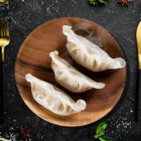 Steamed Chicken Momo · Delightful steamed dumplings filled with finely chopped chicken