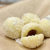Tartufini Al Cocco · A sweet mascarpone treat covered in coconut, with a heart of hazelnut cream. (4pcs.)