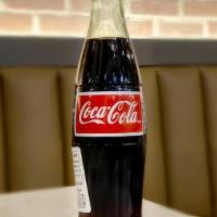 Mexican Coca Cola · Made using cane sugar.