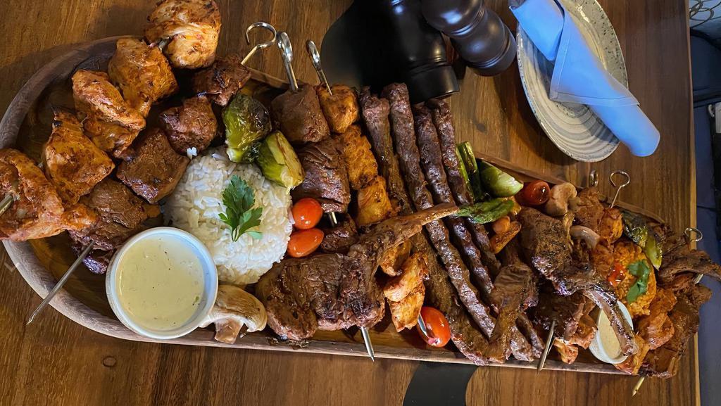 Mega Mix · Enough for 4 people, a combination of chicken kebab, beef kabab, adana kebab and lamb chop, served with grilled vegetables and your choice of the sides.
