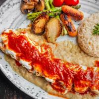 Beyti Kebab · Adana kebab and cheese wrapped in lavash, topped with homemade plain yogurt and drizzled tom...