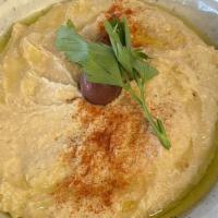 Hummus · Ground chickpeas with garlic, tahini and lemon.