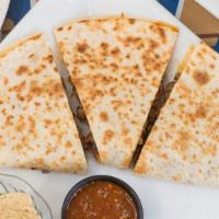 Quesadilla With Filling · Homemade corn tortilla filled with cheese and your choice of filling.