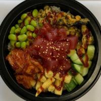 Pb10. Korean Tuna Poke Bowl · Raw tuna marinated with poke sauce, fried nori chips, cucumber, edamame, baby corn, kimchi a...