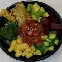 House Tuna Poke Bowl · Raw tuna marinated with poke sauce, fried nori chips, avocado, cucumber, seaweed salad, baby...