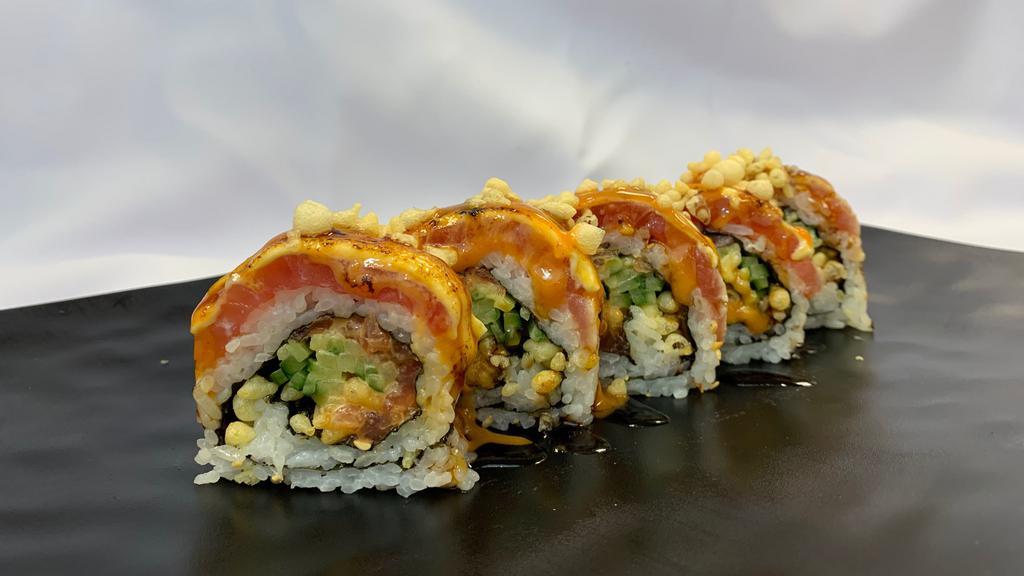 Tuna Volcao Maki · Spicy tuna, cucumber and tempura crunch inside, torch tuna with spicy mayo outside with eel sauce on top