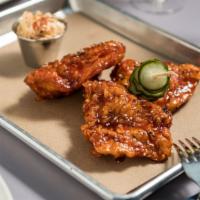 Korean Fried Chicken · crispy fried chicken breast, kimchee slaw, pickled cucumbers
