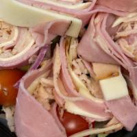 Antipasto Salad · Our garden salad topped with Italian and provolone cheese.
