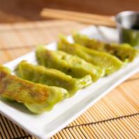 Vegetable Gyoza (6) · Pan-fried vegetable dumpling served with a ginger soy dipping sauce.