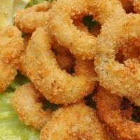 Crispy Calamari · Fresh fried calamari rings in a light batter with our sweet chili sauce.