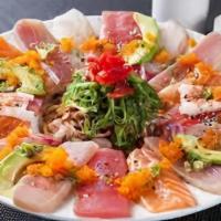 Rainbow Carpaccio · Thin, lightly, seared tuna, salmon, yellowtail, white tuna, topped with onion, scallion, tom...