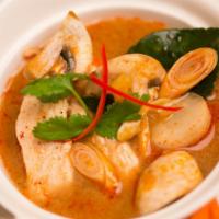 Chicken Tom Yum Soup · Famous, sour, and spicy soup, seasoned with lemongrass, chilies, mushrooms, and lime juice.