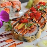 Dynamite Roll · Tuna, salmon, yellowtail, crab, avocado wrapped in seaweed deep fried, topped with masago, s...