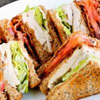 Turkey Club · Lettuce, tomato and bacon. Served with coleslow and pickles.