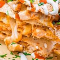 Buffalo Chicken Quesadilla · Chicken, Mozzarella cheese, Blue cheese dressing, buffalo sauce. Served with fries and sour ...