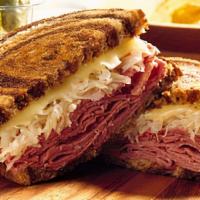 Corned Beef Reuben · Sauerkraut, Russian dressing and swiss cheese. Served with fries.