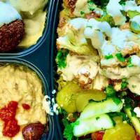 Cauliflower Shawarma Plate · Cauliflower florets with our shawarma spice over basmati rice topped with pickles and tahini...