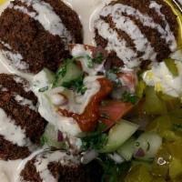 Falafel H Bowl · Home made falafel cooked to order served with pickles and Moroccan salad over homemade hummu...