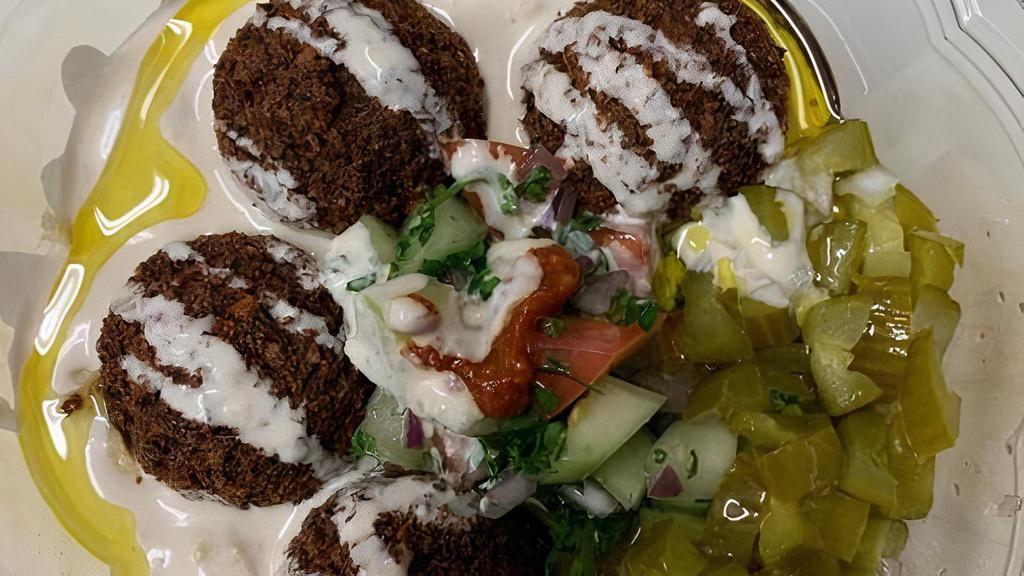 Falafel H Bowl · Home made falafel cooked to order served with pickles and Moroccan salad over homemade hummus and fresh pita